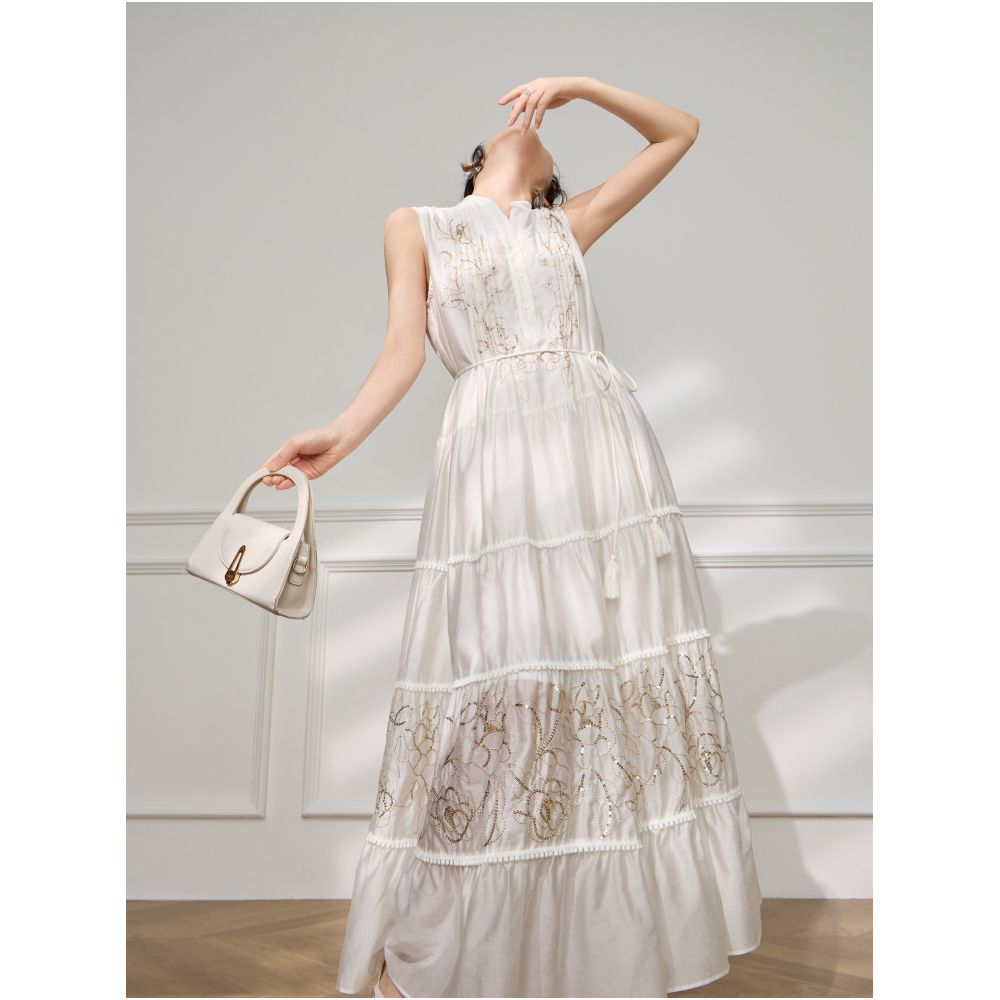 Plum Jan Beach photoshoot outfit off white sleeveless stand neck pleated dress a super pretty dress image 4
