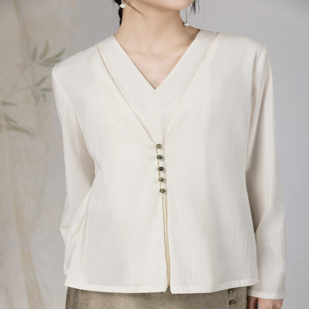 Yyan means new Chinese style white fake two piece shirt with V neck and autumn jade pearl buckle design long sleeved top for women image 1
