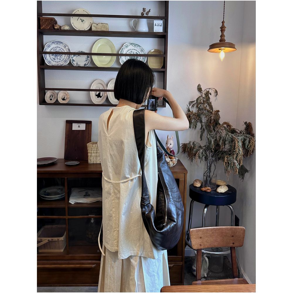 Amidst the surging clouds there is a sense of layering and a heavy deconstruction of the pleated skirt The cool and Zen style suit comes with artistic ties and a vest image 3