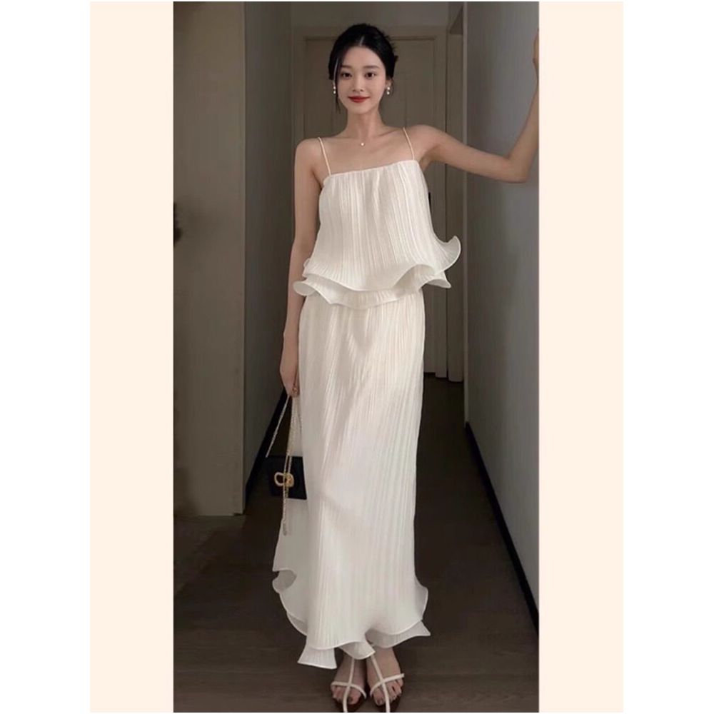 X Rose Two Piece Set A sophisticated pleated design with ruffled trim featuring a high waisted midi skirt and a camisole top image 0