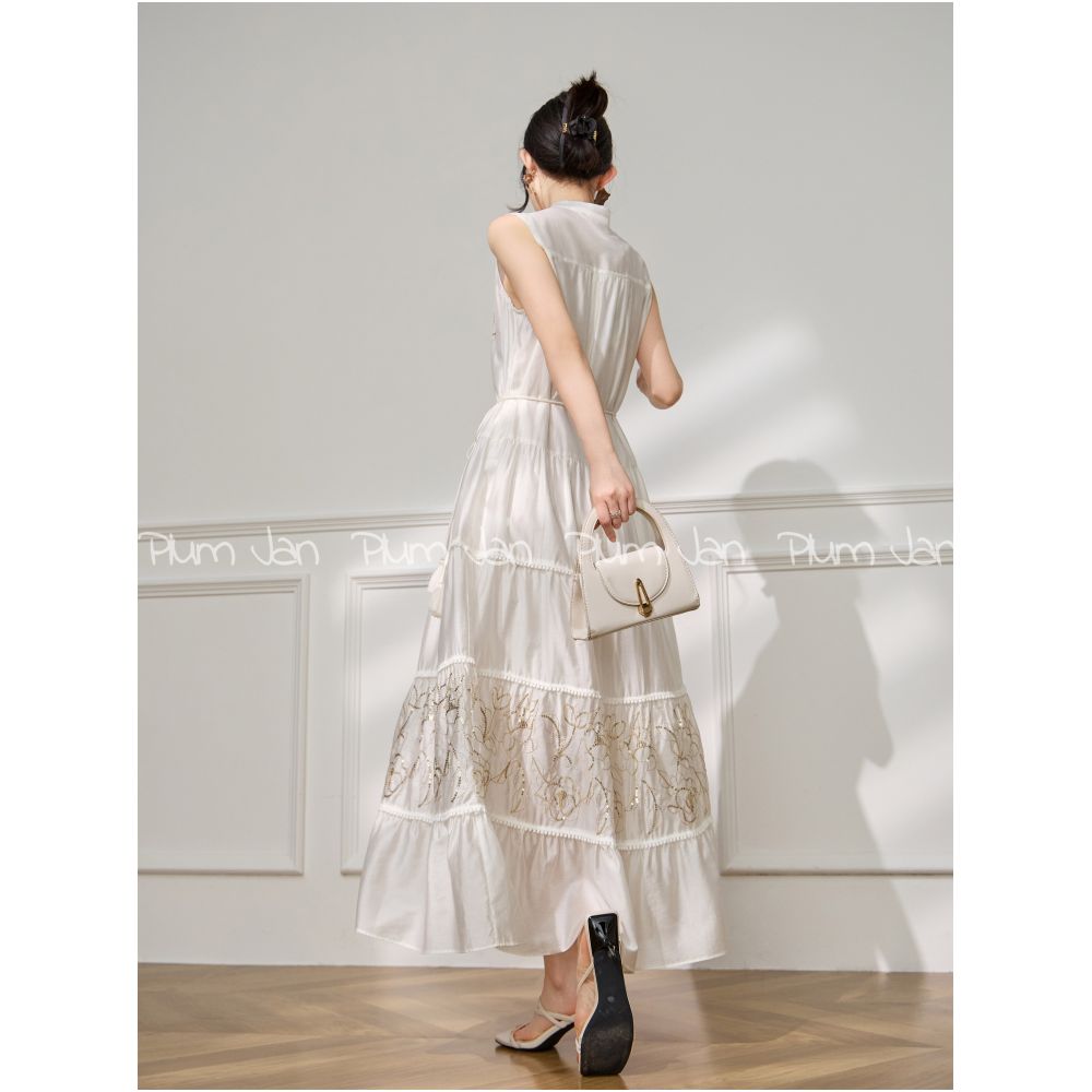 Plum Jan Beach photoshoot outfit off white sleeveless stand neck pleated dress a super pretty dress image 3